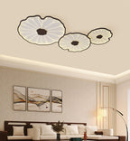 Lotus leaf ceiling light glowing above a calm seating area