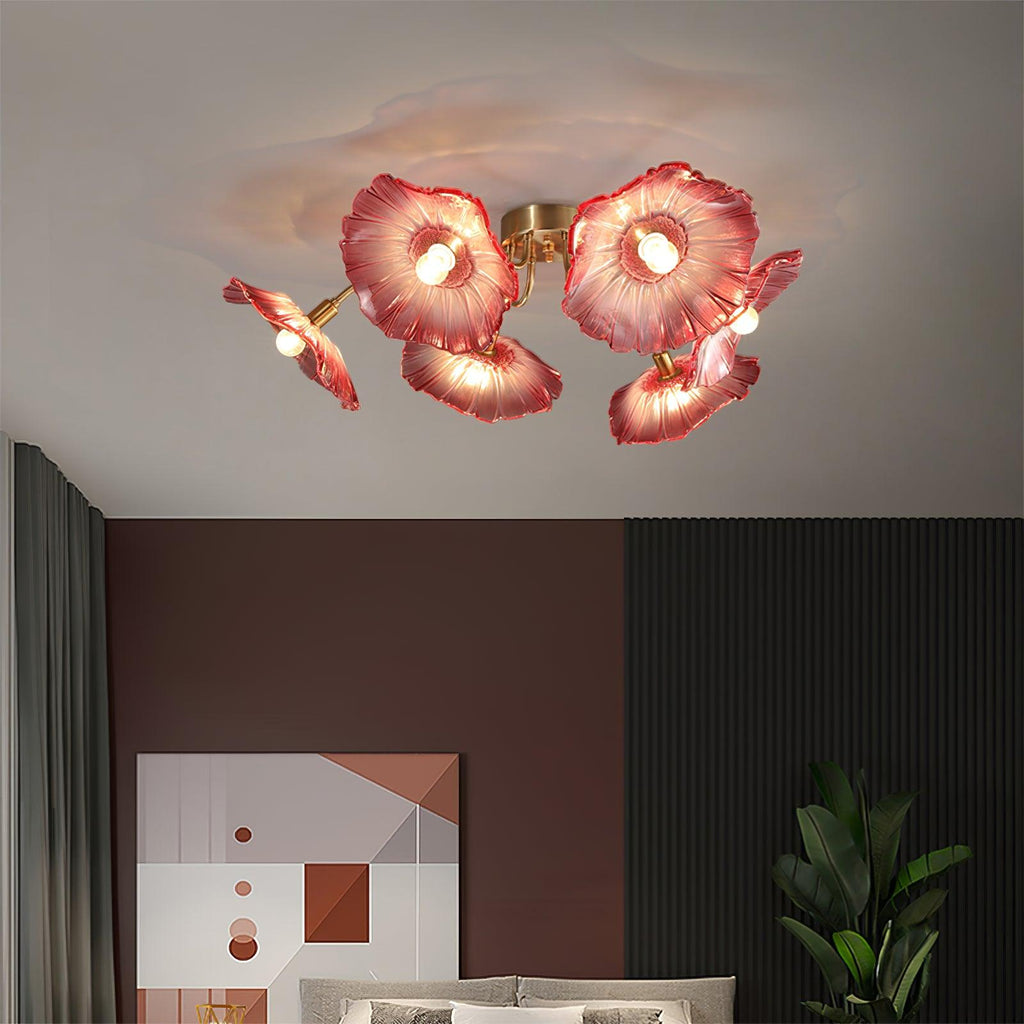 Frosted leaf glass ceiling light with gold body over a living space
