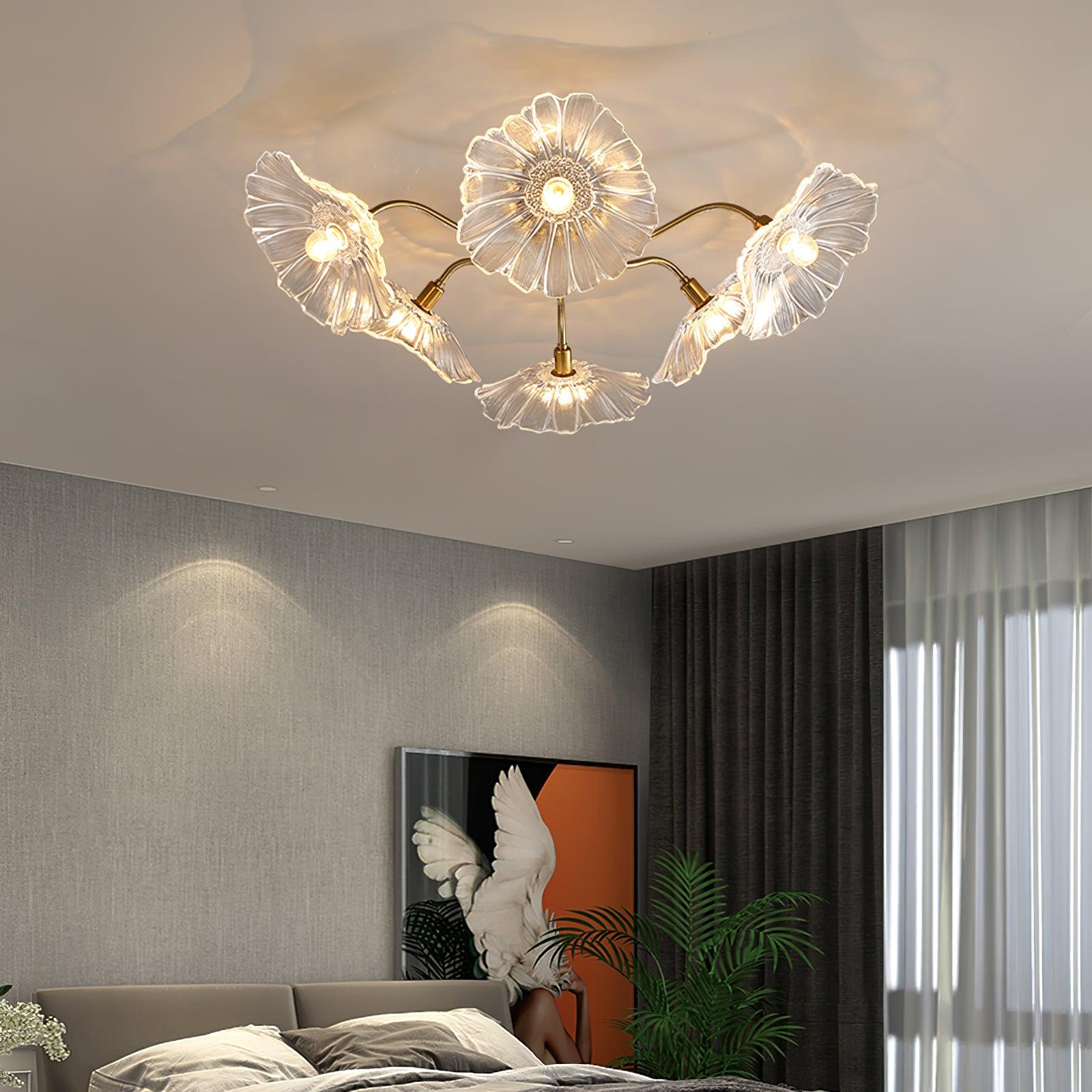 Gold ceiling light with radial frosted glass leaves glowing warmly