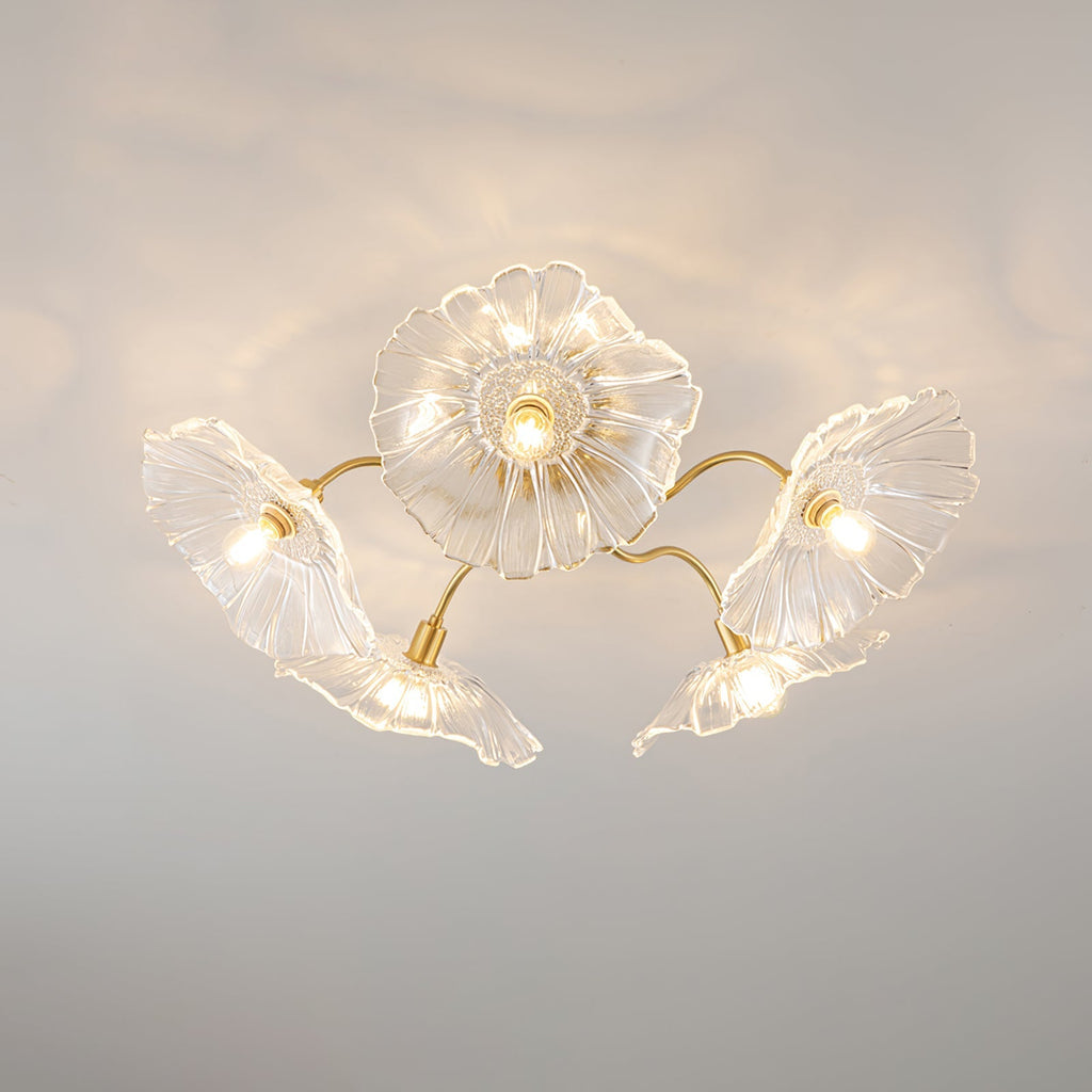 Frosted leaf glass ceiling light with gold hardware lit warmly
