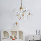 Frosted leaf glass chandelier with a warm gold frame