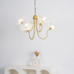 Gold-frame chandelier with scattered frosted leaf shades