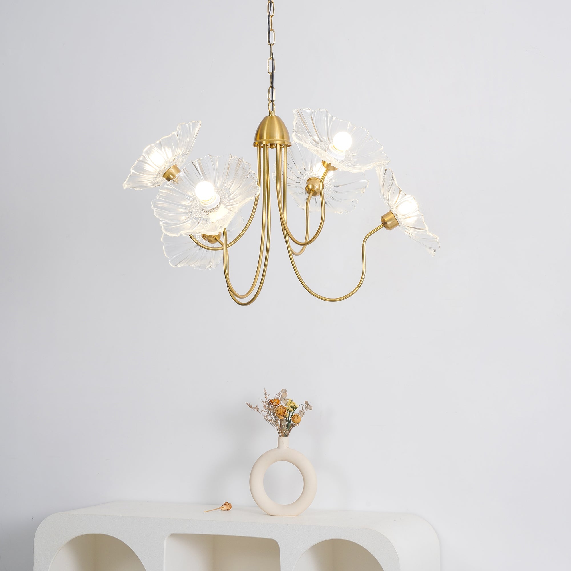 Gold-frame chandelier with scattered frosted leaf shades
