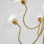 Frosted leaf glass chandelier glowing in a warm room