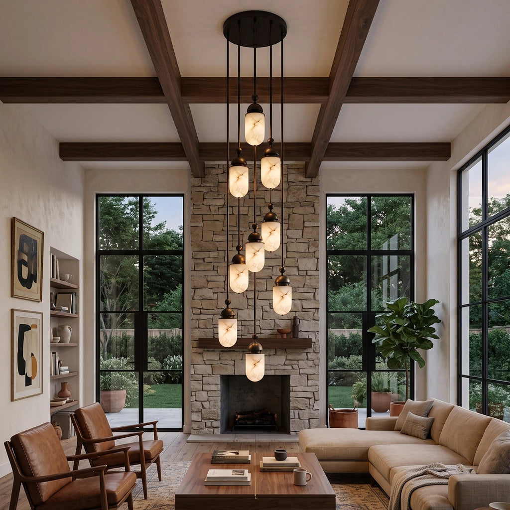 Above a leather sofa and stone fireplace, this Clérachic pendant's alabaster capsules cluster densely under timber beams.