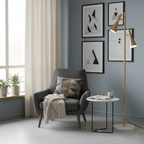 Brass Clérachic floor lamp on a marble base beside a grey armchair with a patterned cushion and a small side table.