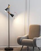 Diagram of a Clérachic floor lamp with red arrows marking how each shade swivels, a beige armchair alongside.