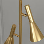 Macro view of both shade heads and swivel joints on an all-brass Clérachic floor lamp against a plain background.
