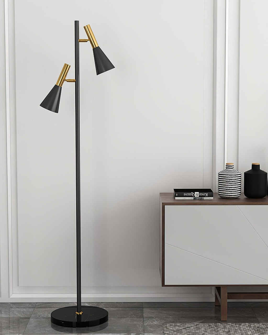 Bowls and vases fill a wood console table against a white wall beside a black and brass Clérachic floor lamp.