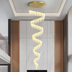 Sylirion spiralling the full height of a living room, above a dark media unit on a marble wall