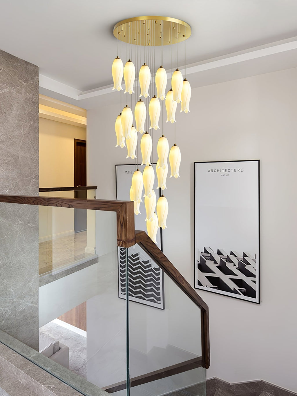Sylirion descending a stairwell with a wood-and-glass handrail, next to a framed architecture print