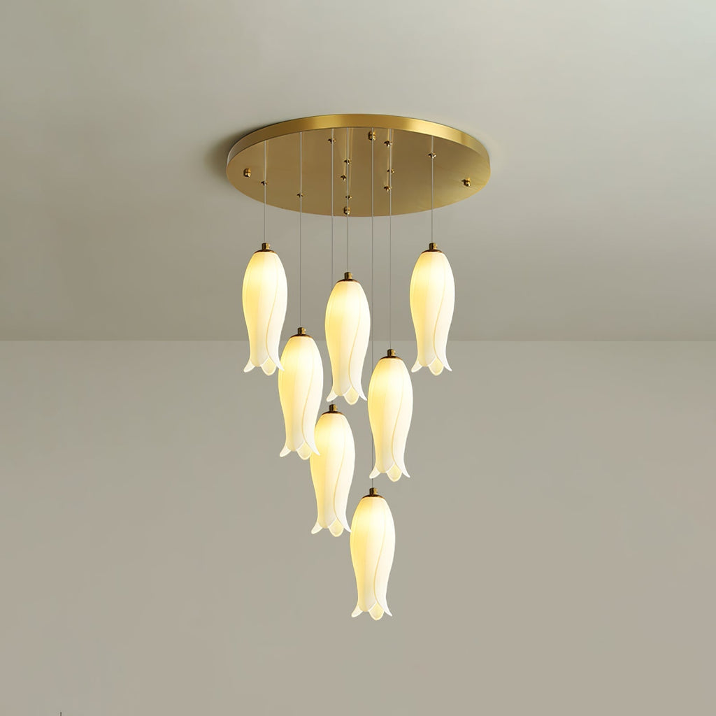 Sylirion ceramic chandelier in its compact seven-light version, warm-lit under a round gold ceiling plate