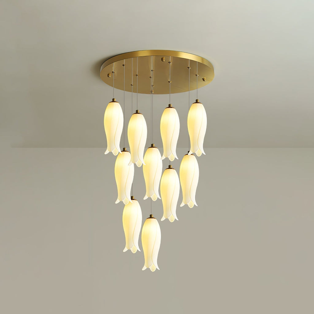Ten-light Sylirion in the shorter drop, its bell-shaped ceramic shades clustered close to the ceiling