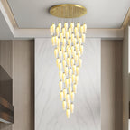Sylirion in a double-height room, its cascade set against a white marble panel and wood-slat walls