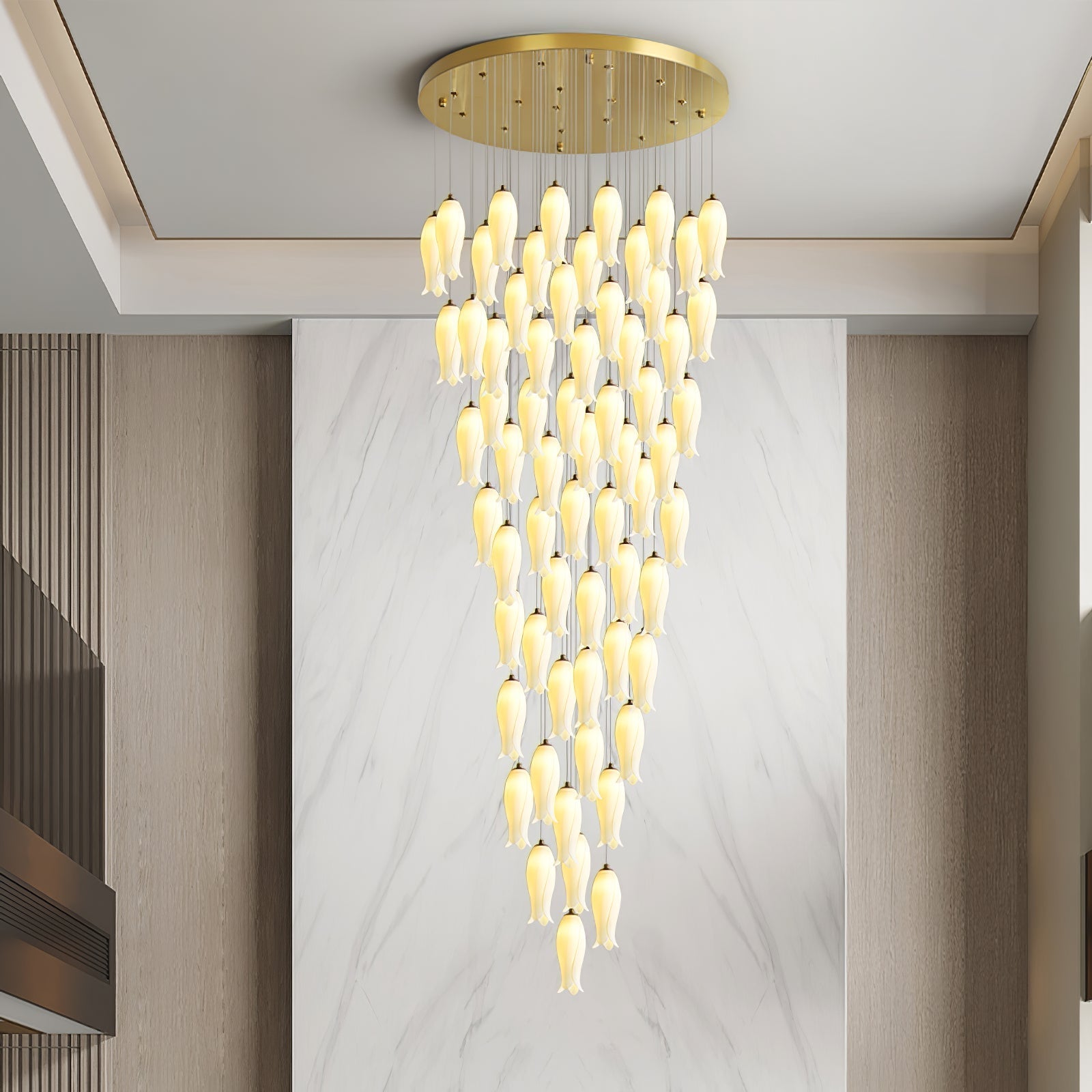 Sylirion in a double-height room, its cascade set against a white marble panel and wood-slat walls
