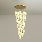 Twenty-eight-light Sylirion in the shorter drop, a dense curtain of lit ceramic shades