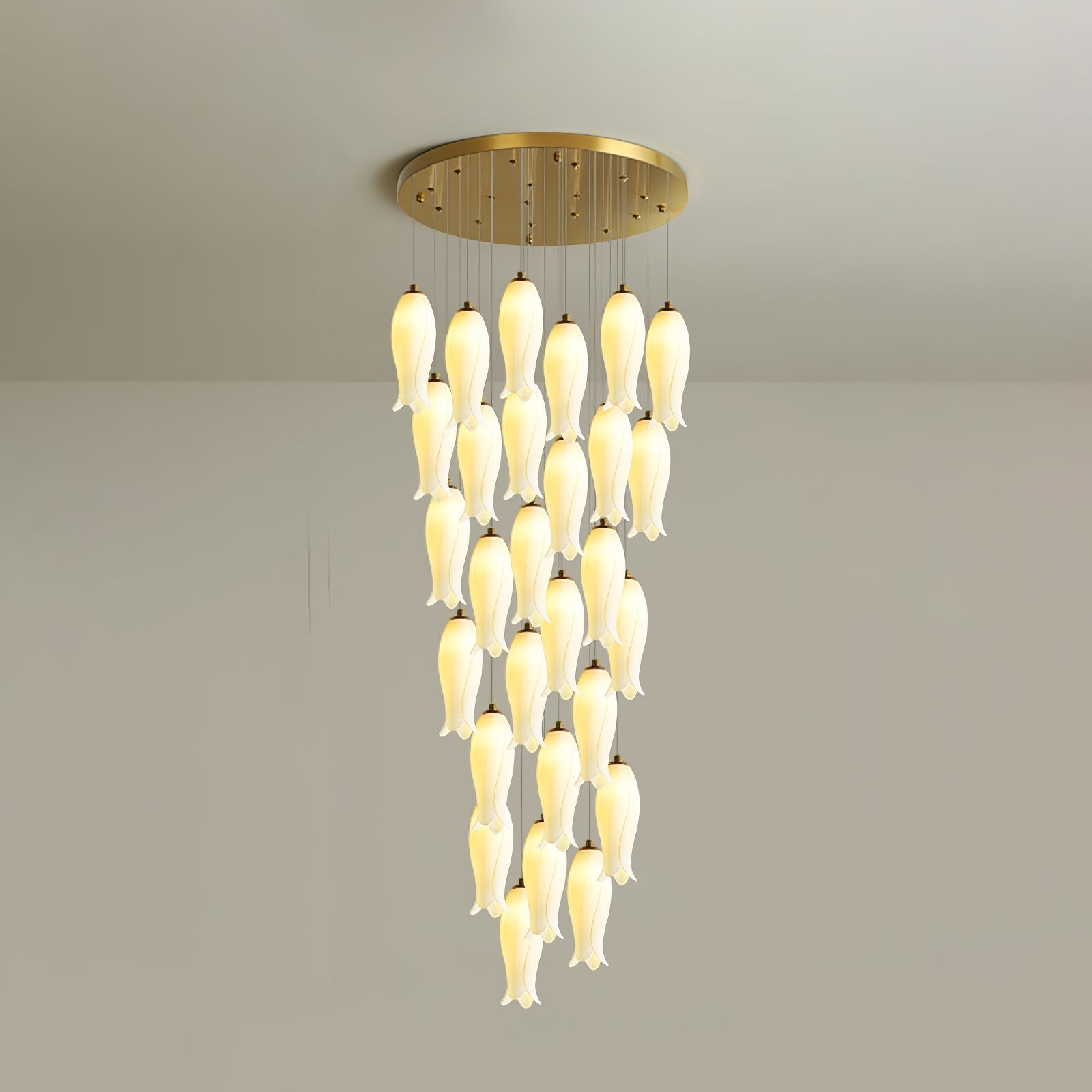 Twenty-eight-light Sylirion in the shorter drop, a dense curtain of lit ceramic shades