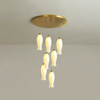 The seven-light Sylirion in its taller drop, shades staggered down a longer cascade from the gold plate