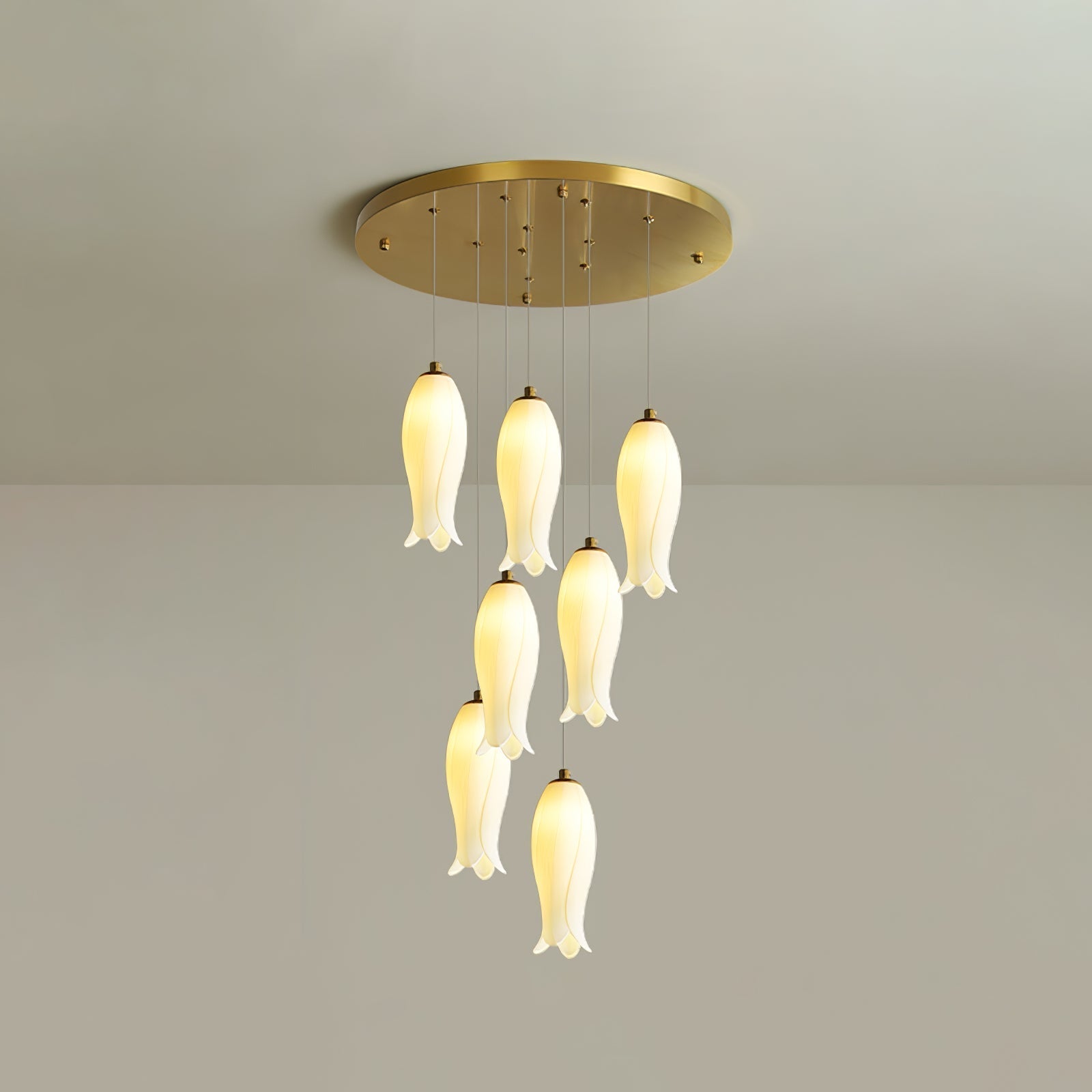 The seven-light Sylirion in its taller drop, shades staggered down a longer cascade from the gold plate