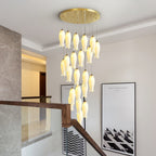 Wider view of the Sylirion in a stairwell, shades lit above the wood handrail and glass balustrade