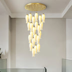 Sylirion lit in a plain, pale-walled room, the full drop visible from canopy to lowest shade tip