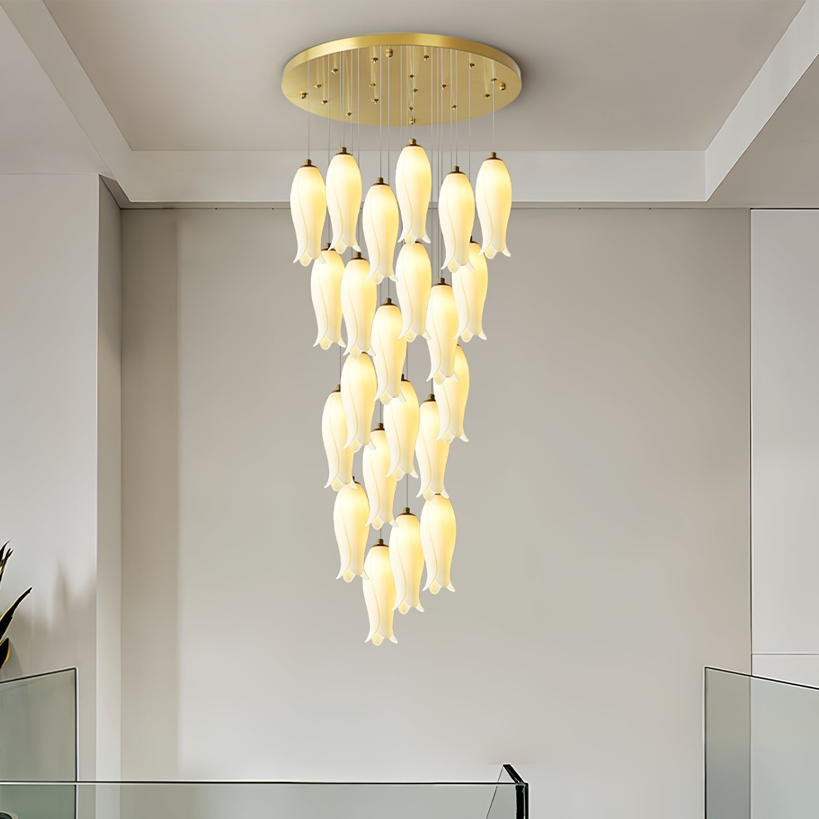 Sylirion lit in a plain, pale-walled room, the full drop visible from canopy to lowest shade tip