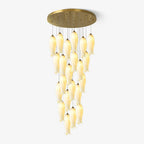 Sylirion chandelier on a plain white background, gold plate above a full cascade of ceramic shades