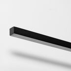 Close view of the matte, square-edged aluminium bar on this Clérachic wall light.