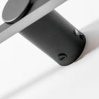 Extreme close view of this Clérachic wall light's mounting cylinder, showing its sensor and fixing screw.