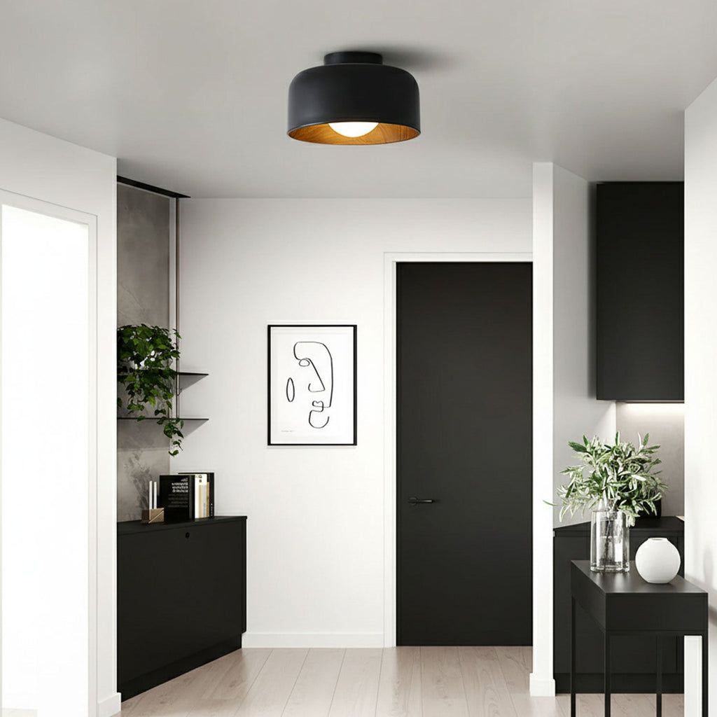 White glass globe light against a clean ceiling