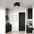 White glass globe light against a clean ceiling