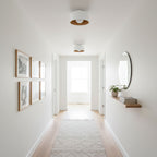 White glass globe light with a matte black shell