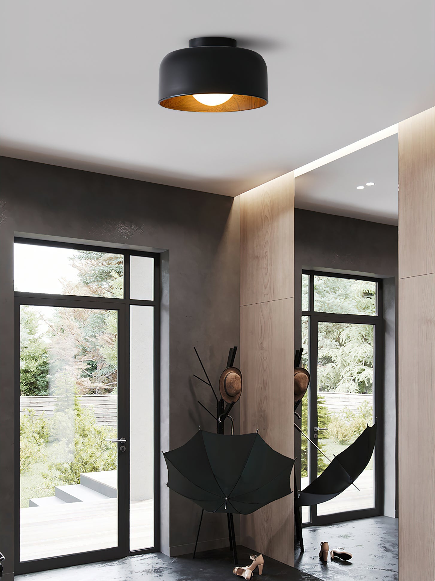 Globe ceiling light glowing warm in a small space