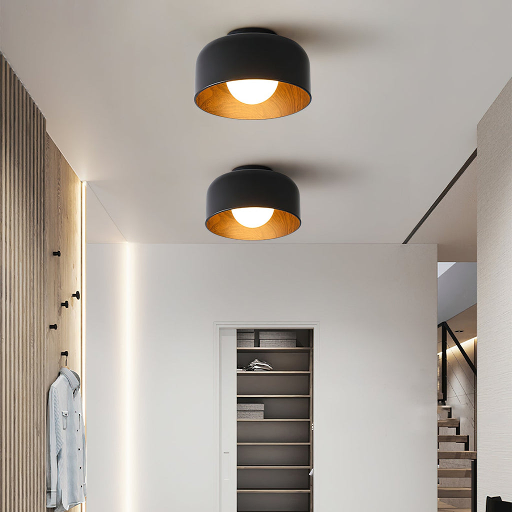 Globe ceiling light with warm wood-grain interior glow