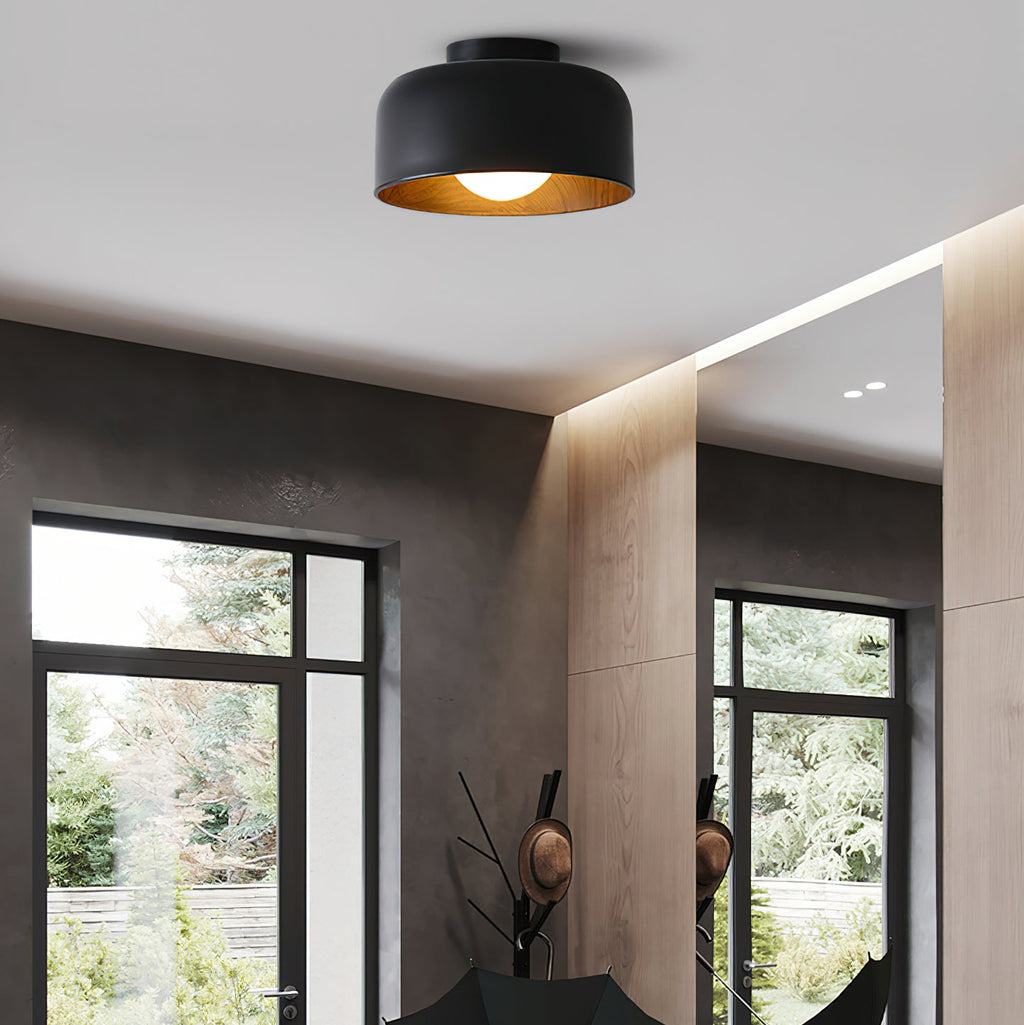 Glass globe ceiling light lit in a hallway