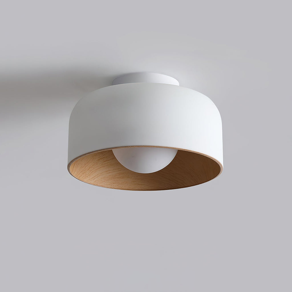 Glass globe light glowing with a warm wood-grain interior