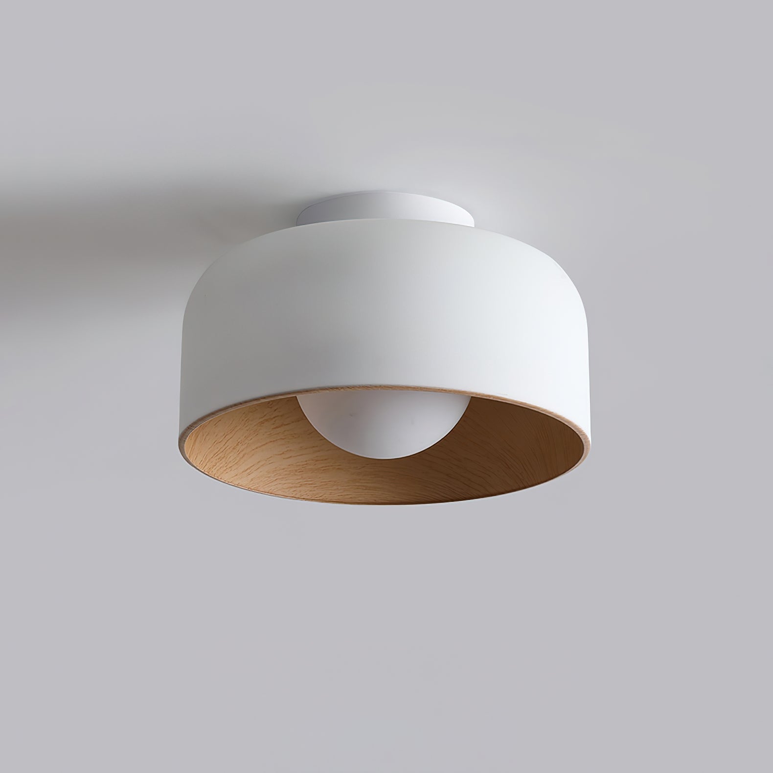 Glass globe light glowing with a warm wood-grain interior