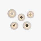 Clérachic alabaster wall sconce shown in five finish options, each soft-edged stone disc glowing warm around a different coloured centre panel.