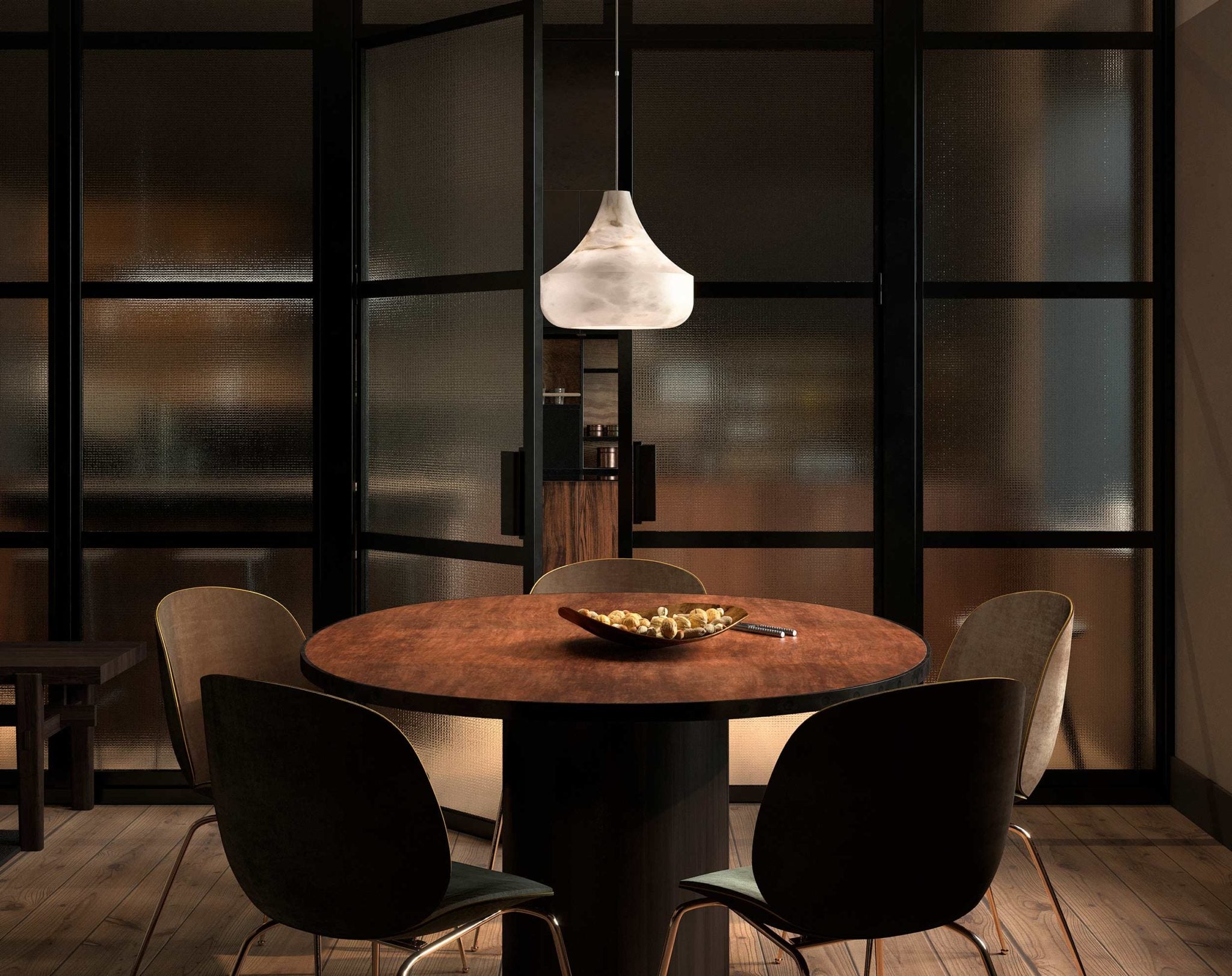 Eye-level view of the Tyler pendant lit over a round dining table, framed by a black-framed glass partition.