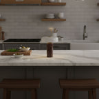 Table lamp with brass accent between marble and glass