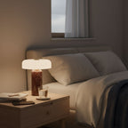 Cordless marble table lamp in a cosy reading nook