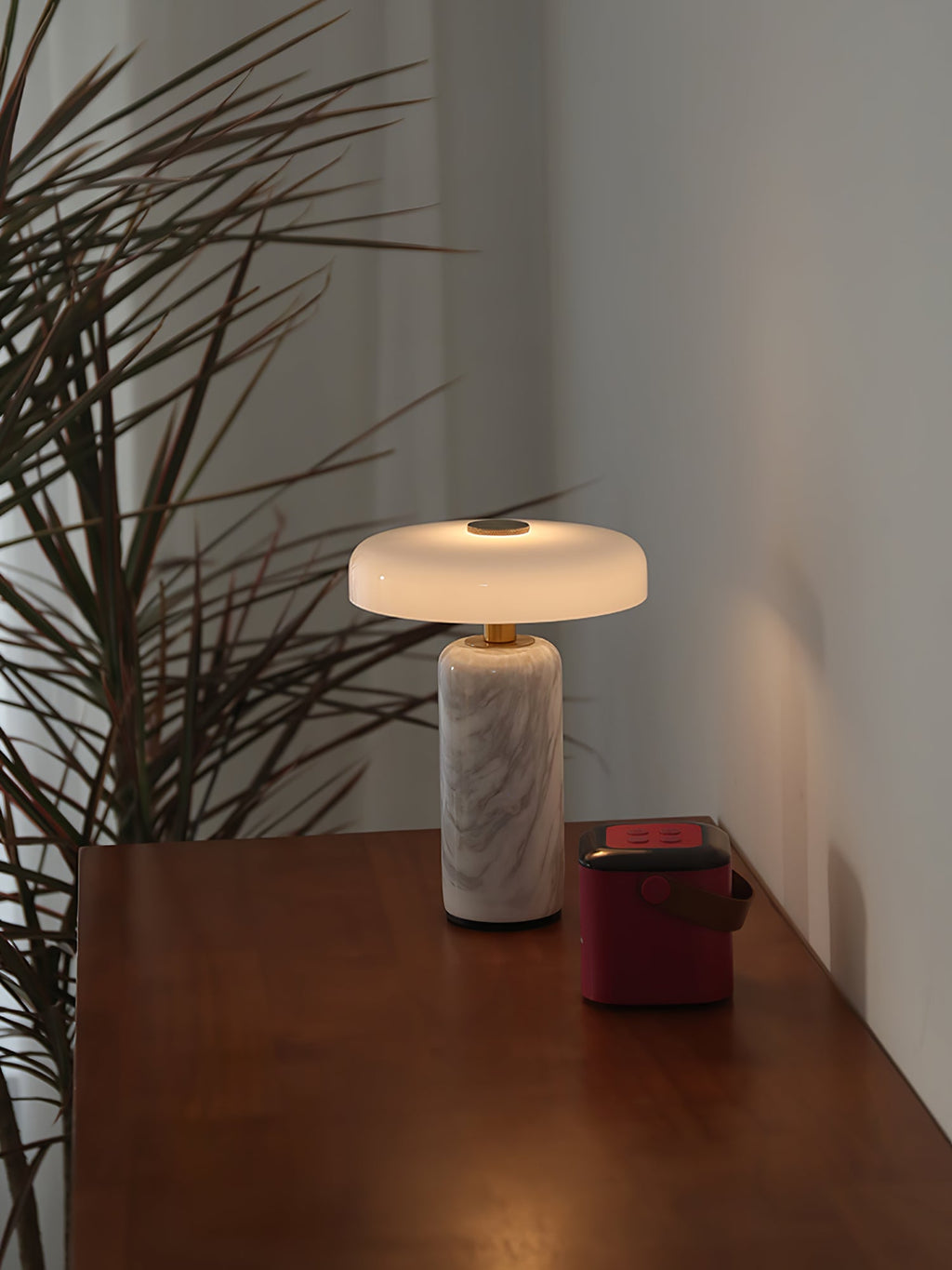 Opaline glass shade floating above a marble lamp base