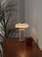 Opaline glass shade floating above a marble lamp base