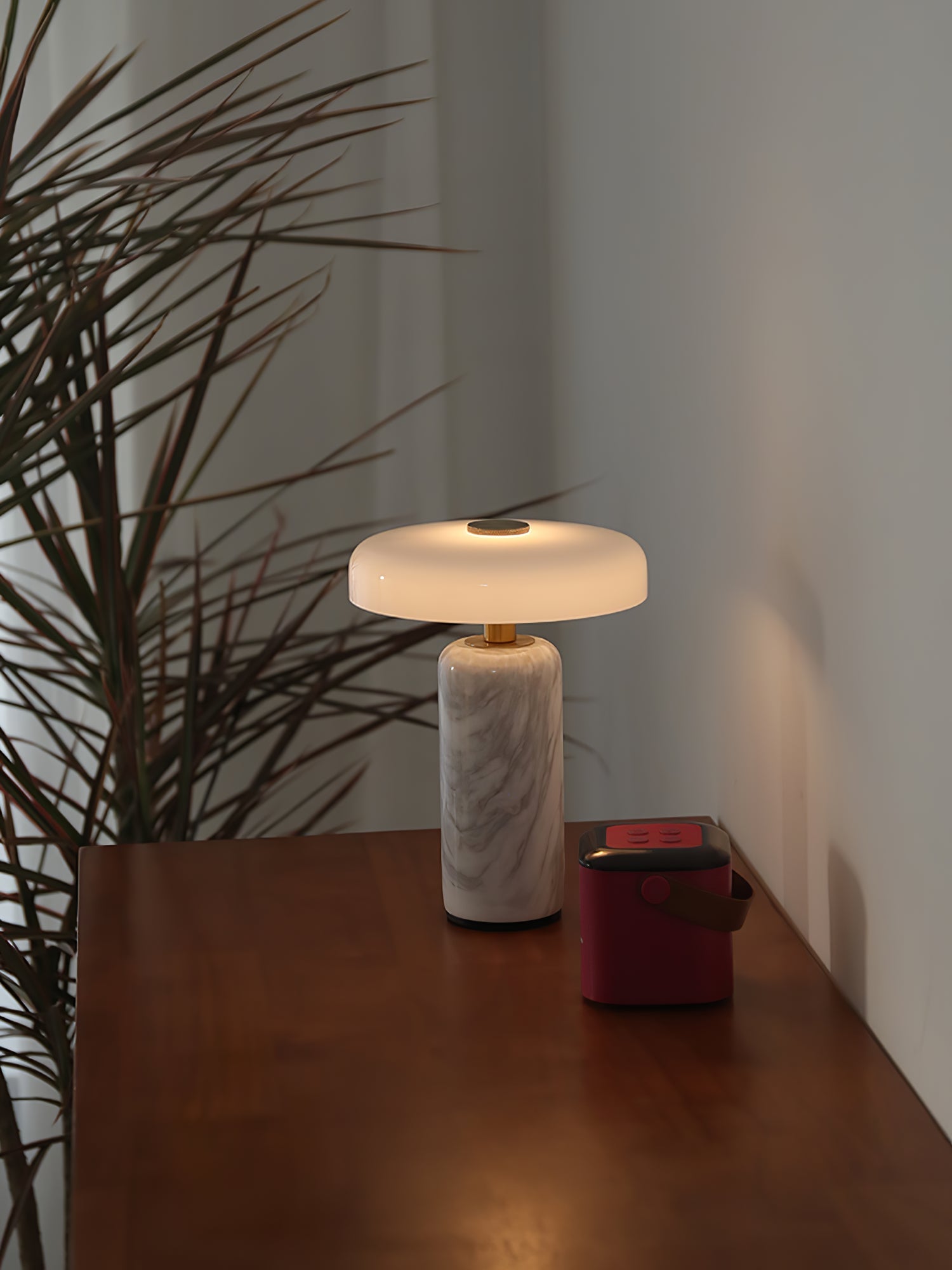 Opaline glass shade floating above a marble lamp base