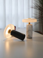 Opaline glass shade on a dark veined marble lamp