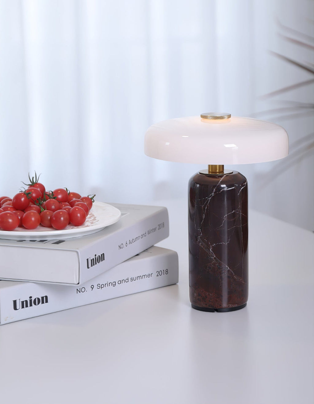 Cordless marble table lamp with a soft opaline glow