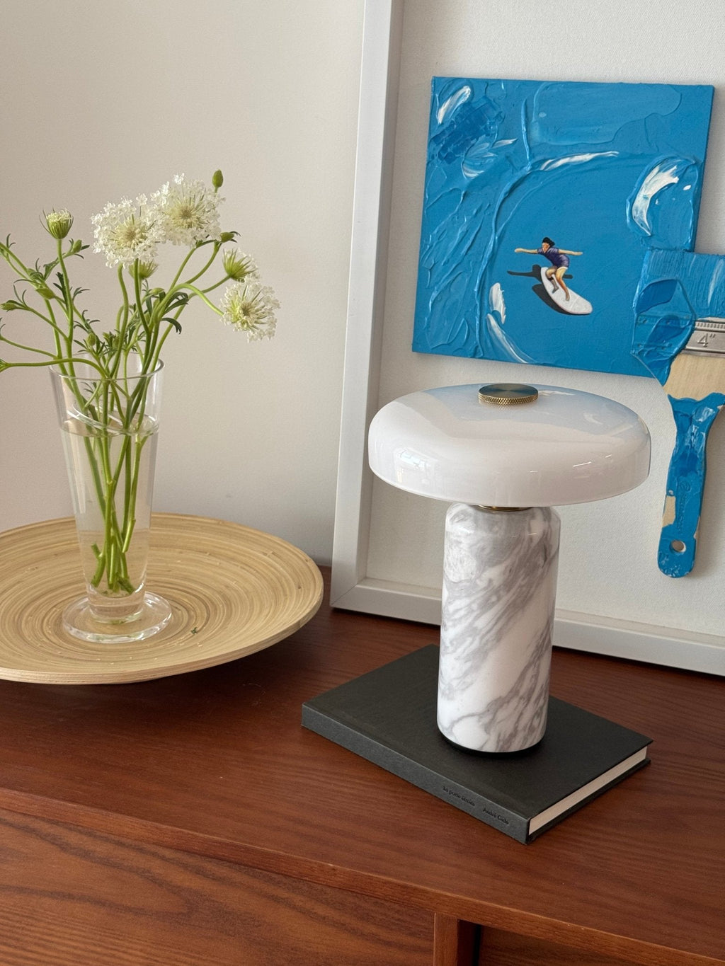White marble table lamp with a round opaline shade