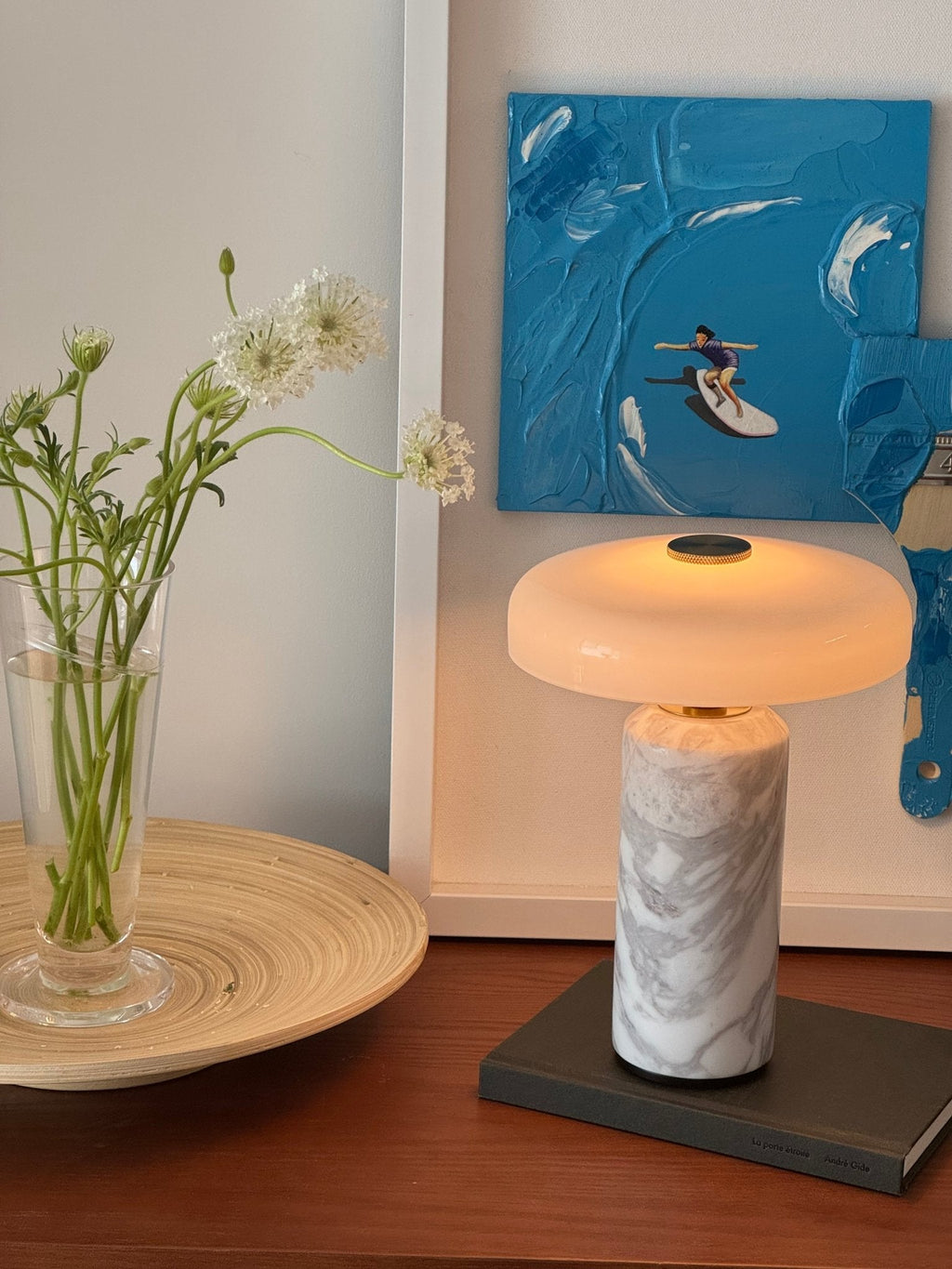 Cordless marble table lamp on a styled sideboard