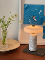 Cordless marble table lamp on a styled sideboard