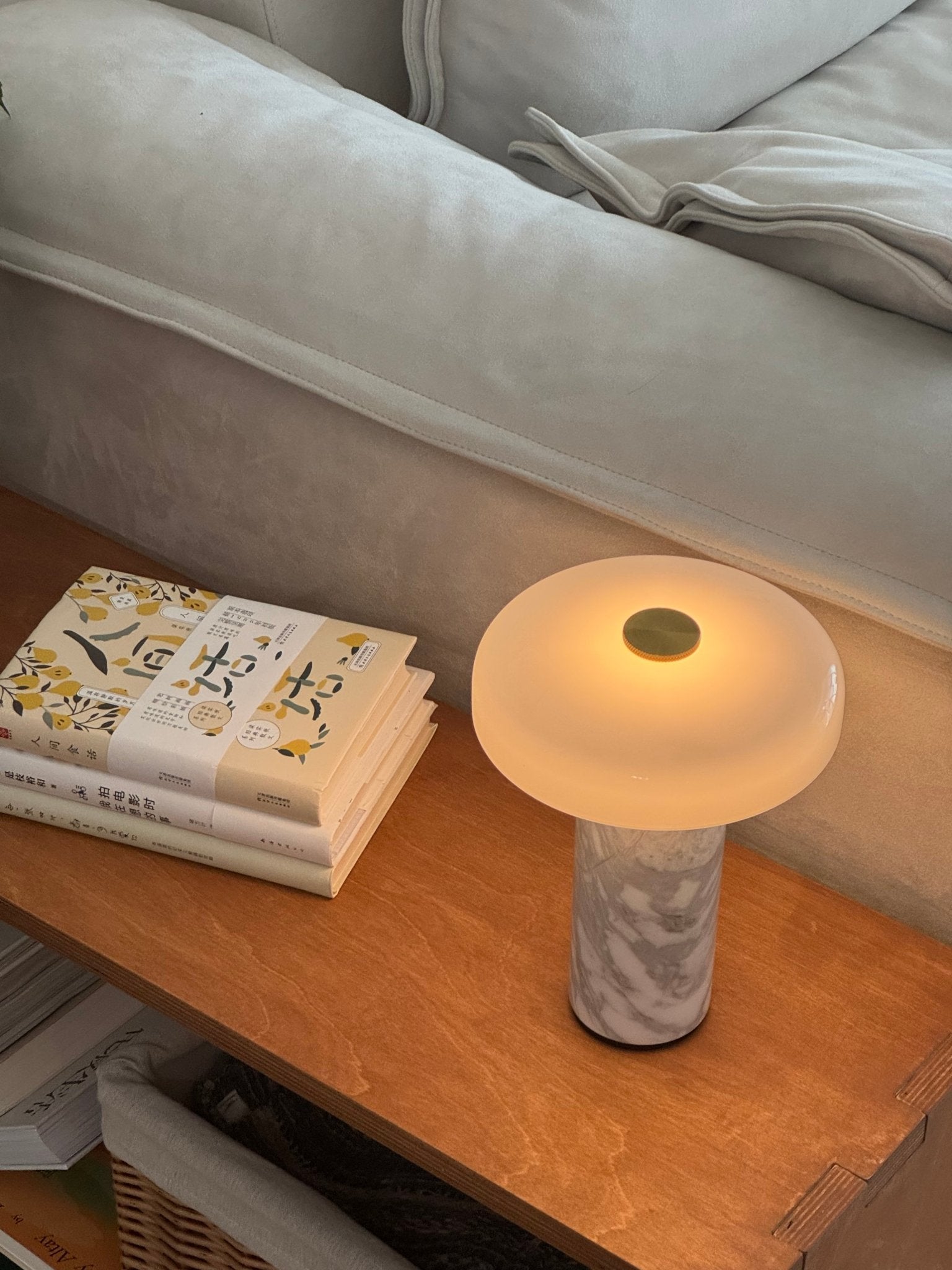 Marble table lamp with brass accent and glass shade